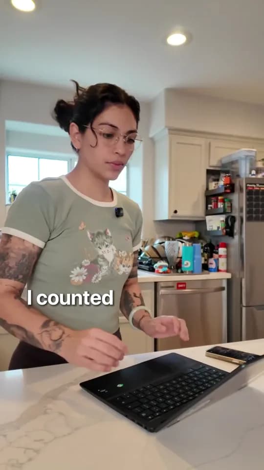 A creator at her desk, working through repetitive tasks